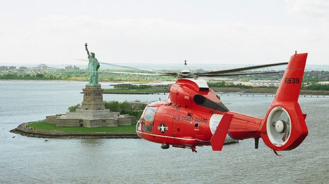 Helicopter flight experience day flying over the Statue of Liberty New York City