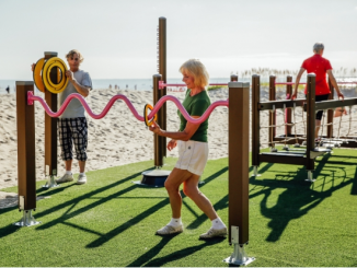 Senior citizens exercising at an outdoor fitness park
