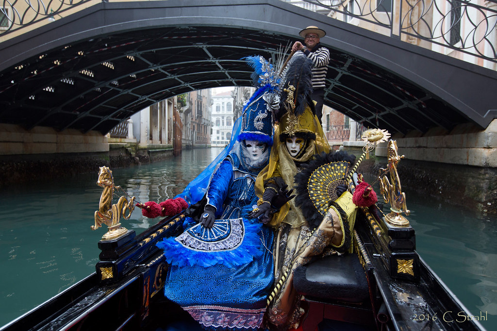 Masquerade Ball costumes in Venice on a gondola