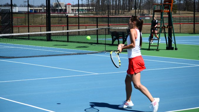 Woman playing tennis on a tennis holiday