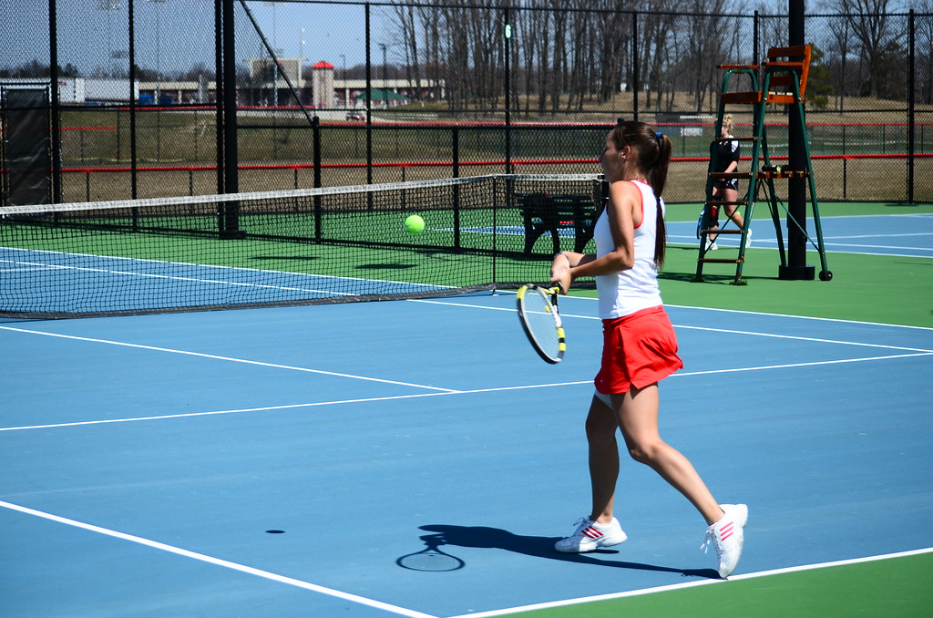 Woman playing tennis on a tennis holiday