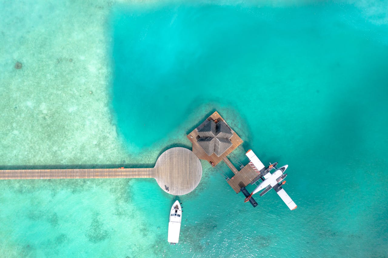 Seaplane docked in the Seychelles next to a private beach resort