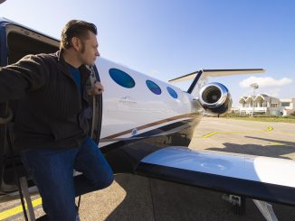 Adventurer steping out of his private jet