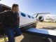 Adventurer steping out of his private jet